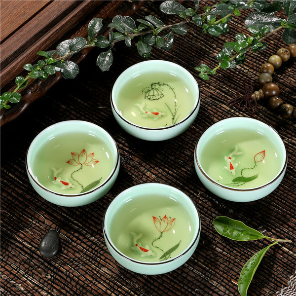 Goldfish Swimming in your teacup.  Hand-painted Longquan Celadon Porcelain - Set of Two