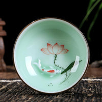 Goldfish Swimming in your teacup.  Hand-painted Longquan Celadon Porcelain - Set of Two
